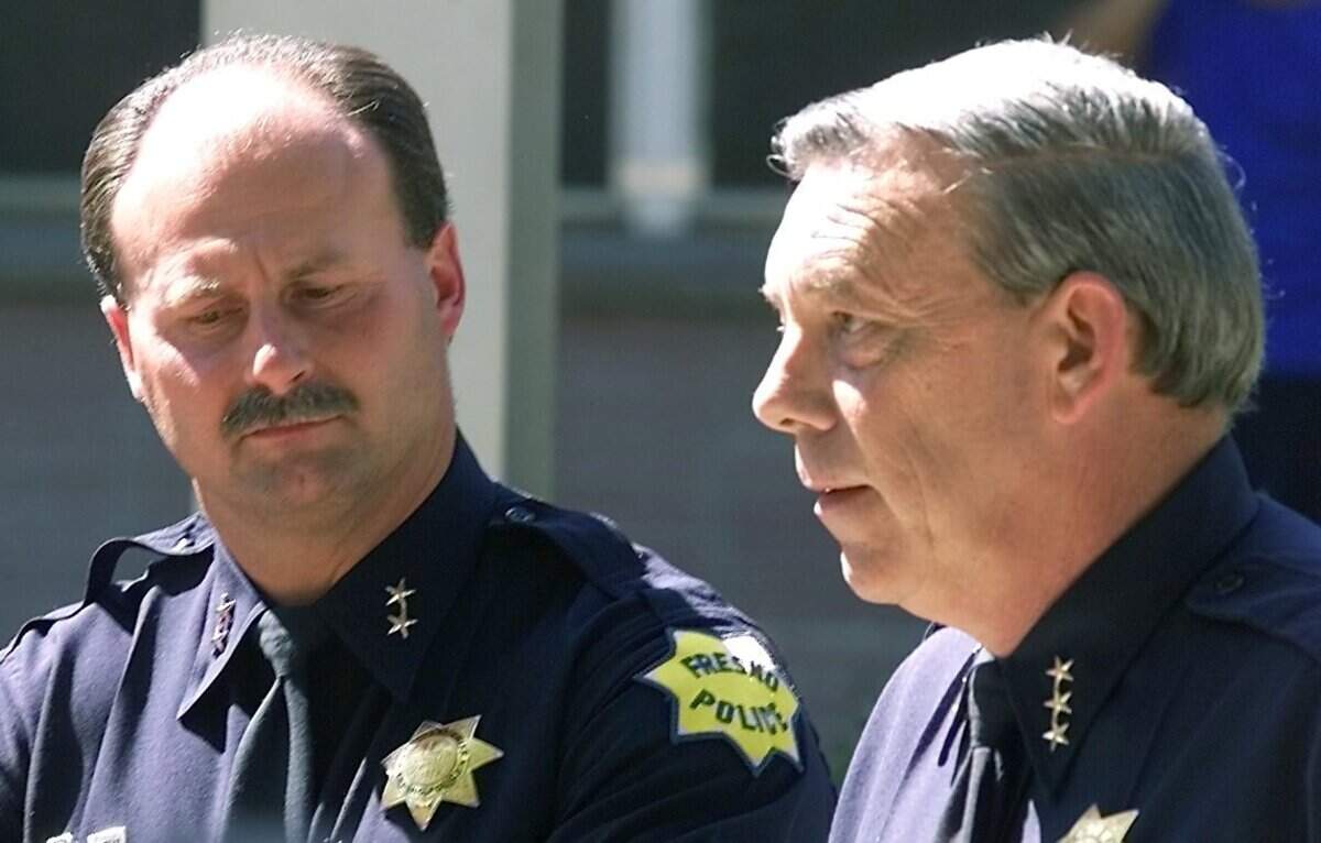 New Chief of Police Jerry Dyer and old Chief of Police Ed Winchester at the ceremony announcing the change in front of police headquarters on Wednesday afternoon July 18, 2001.